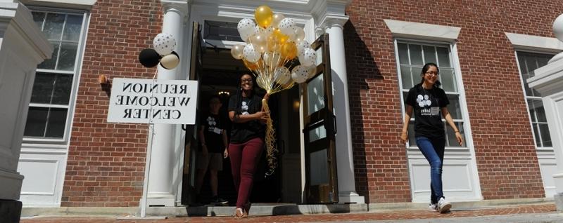 Volunteers with balloons at Reunion