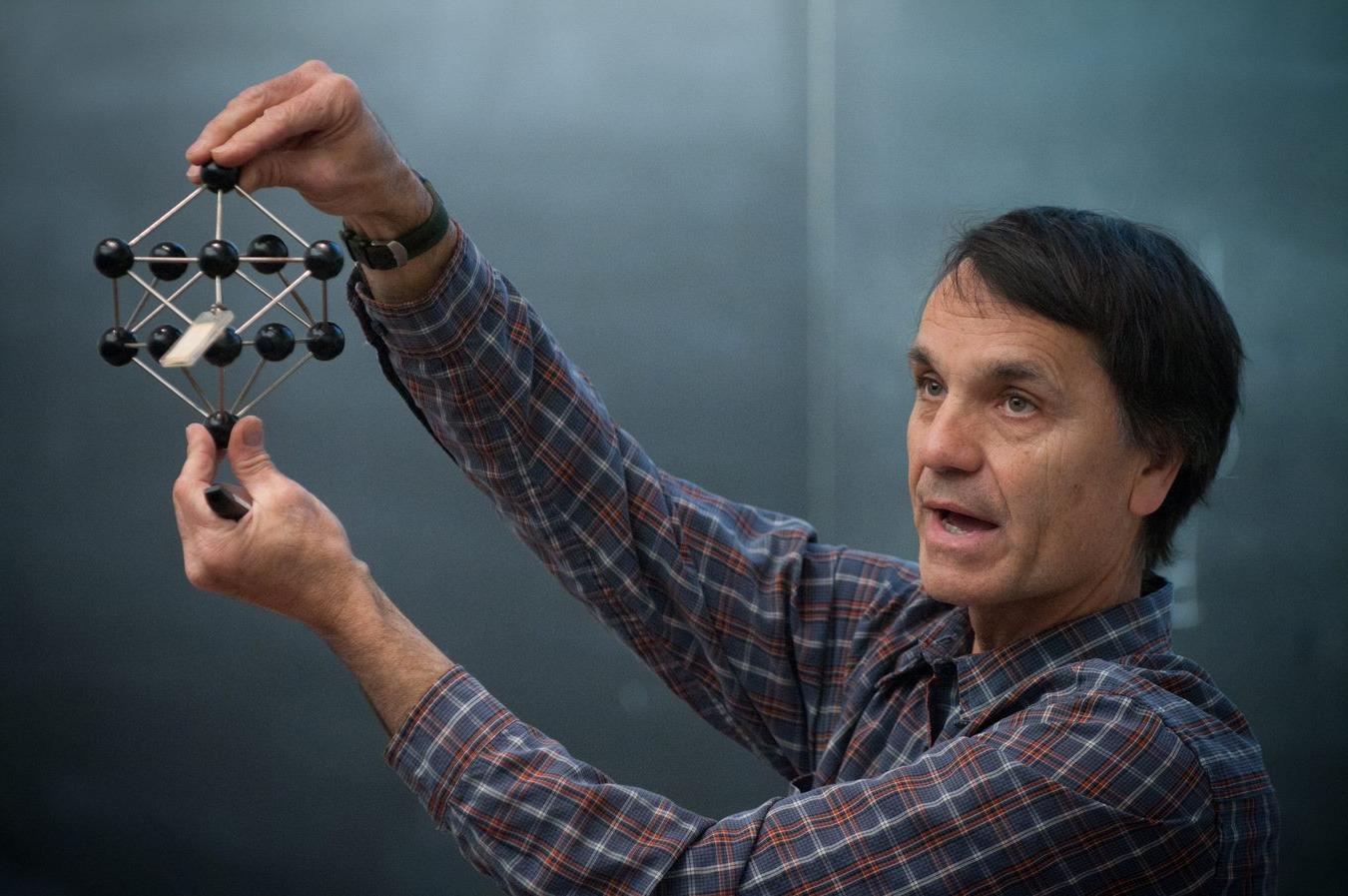 Professor Jeff Nagle holding a chemical structure