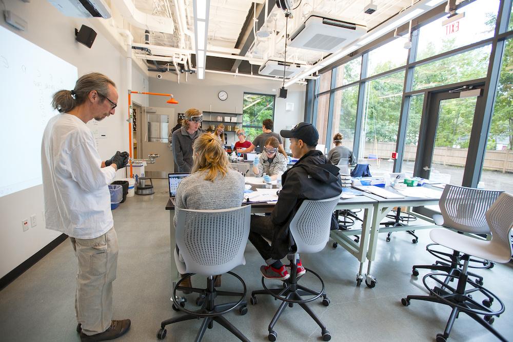 Phil Camil with students in  science classroom