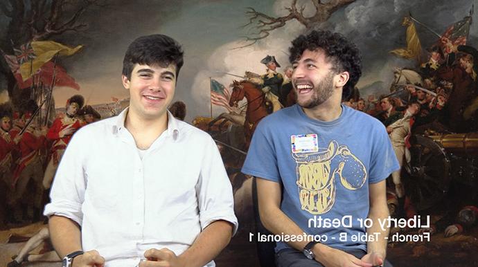 Students smile in front of revolutionary war painting