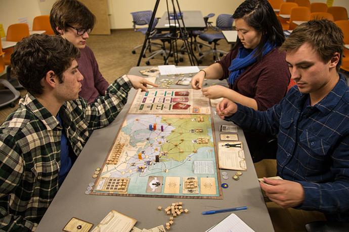 students play tabletop game