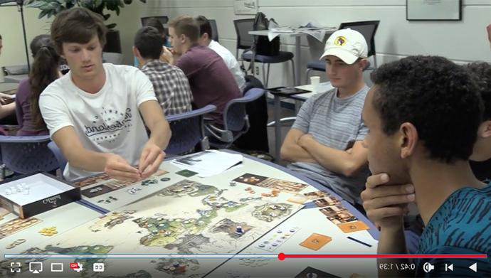 students play table top game